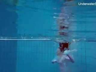 Redhead simonna showing her body underwater