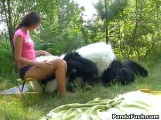 Bayan in the woods with a huge toy panda